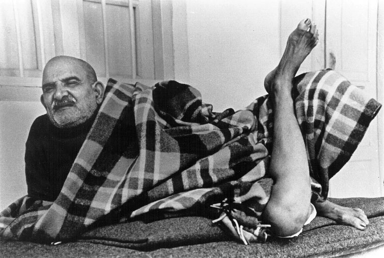 Maharaj-ji reclining on a takht